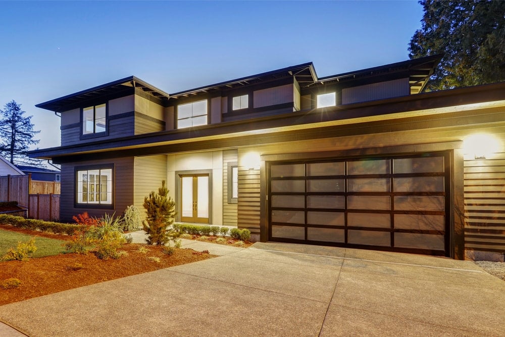 A home with a aluminum-frame garage door